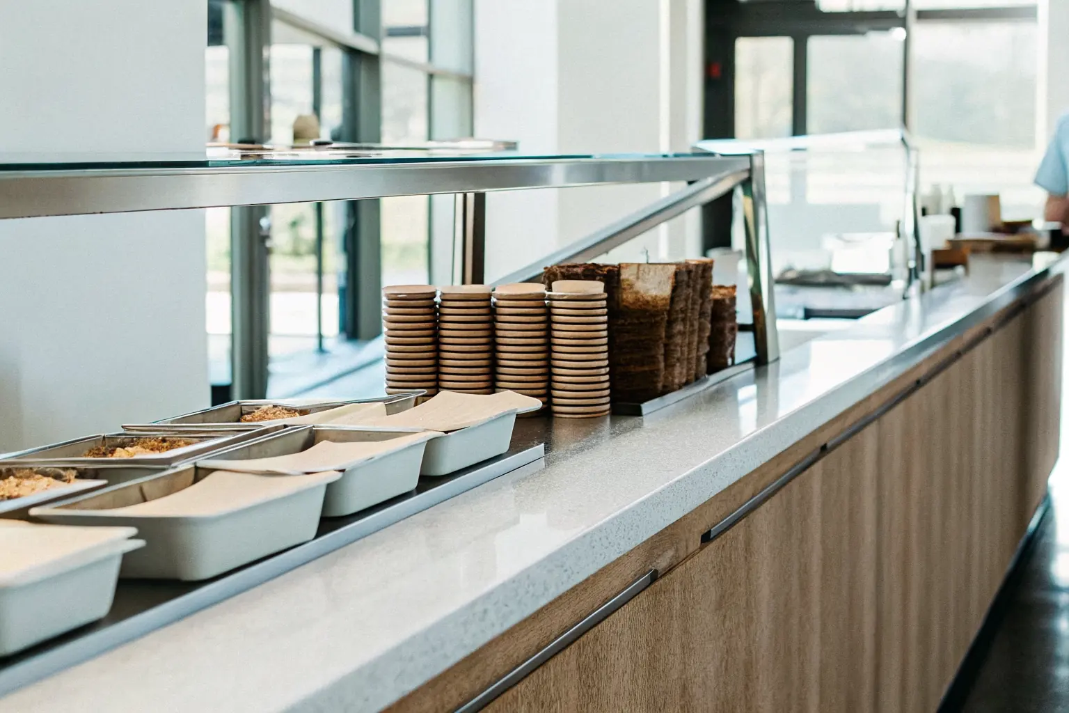 Hospital cafeteria counter with compostable trays and containers, representing the hospital sustainability program